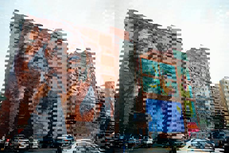 Pop-Up Art Installations Invade City Alleys With Unexpected Sculptures and Murals